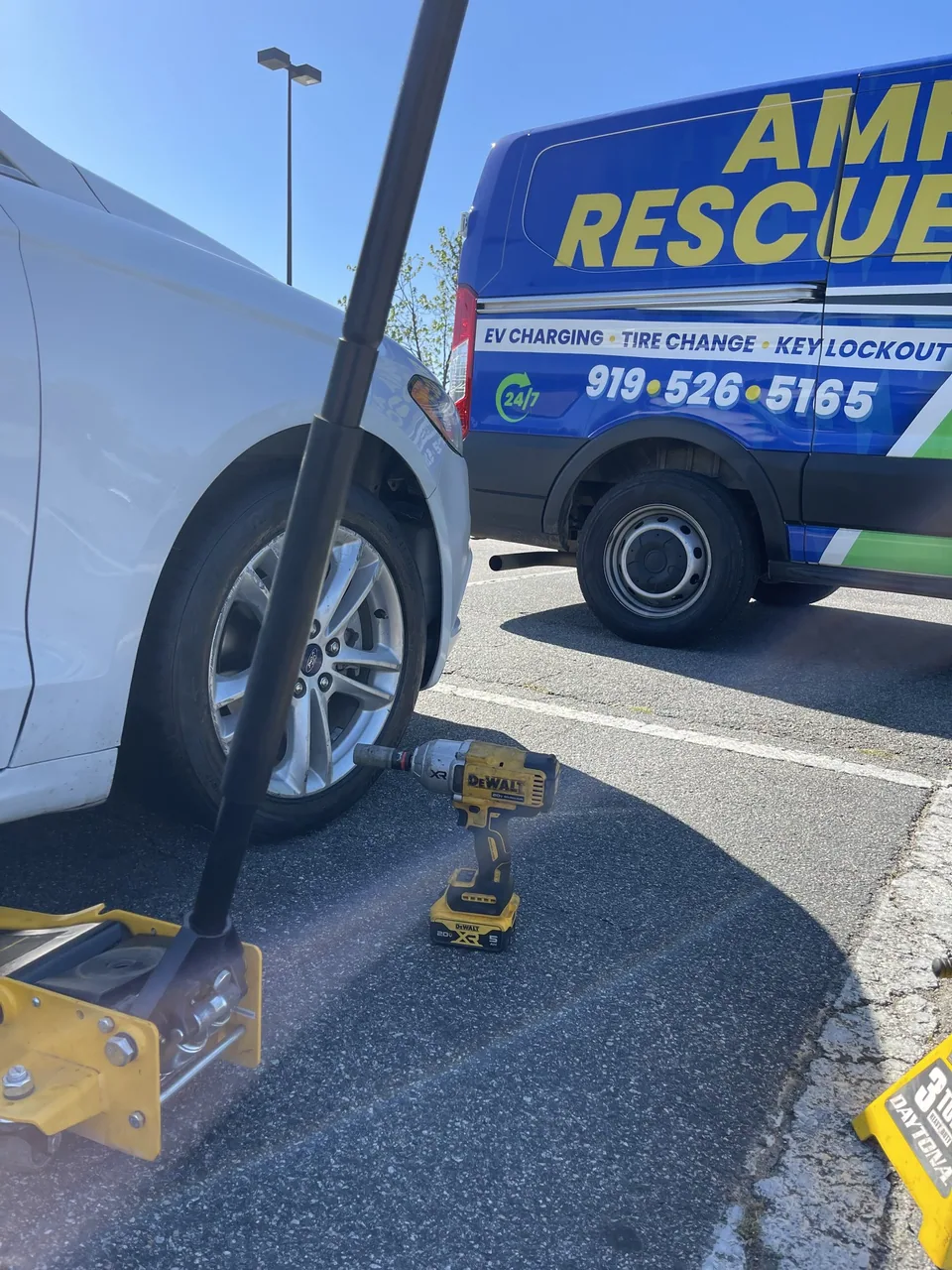 Amp Rescue providing mobile tire service in a parking area