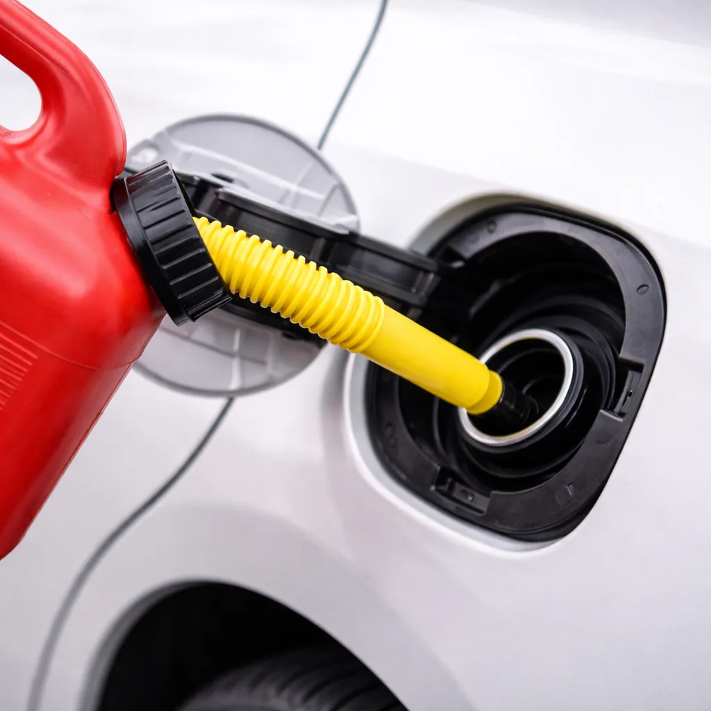 Emergency gasoline being added to a vehicle after the correct fuel type is confirmed